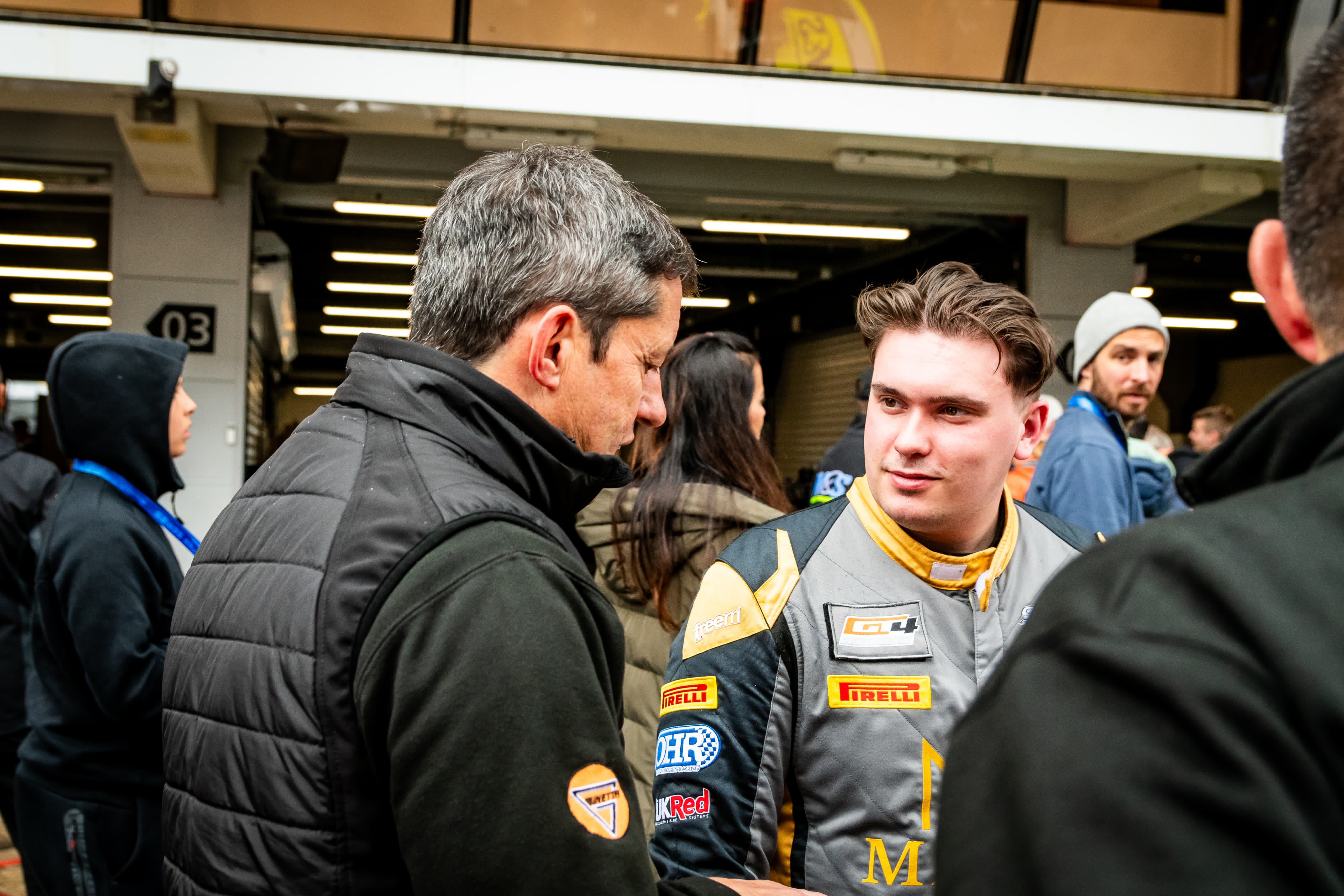 Owen Hizzey speaking with a team member in the paddock