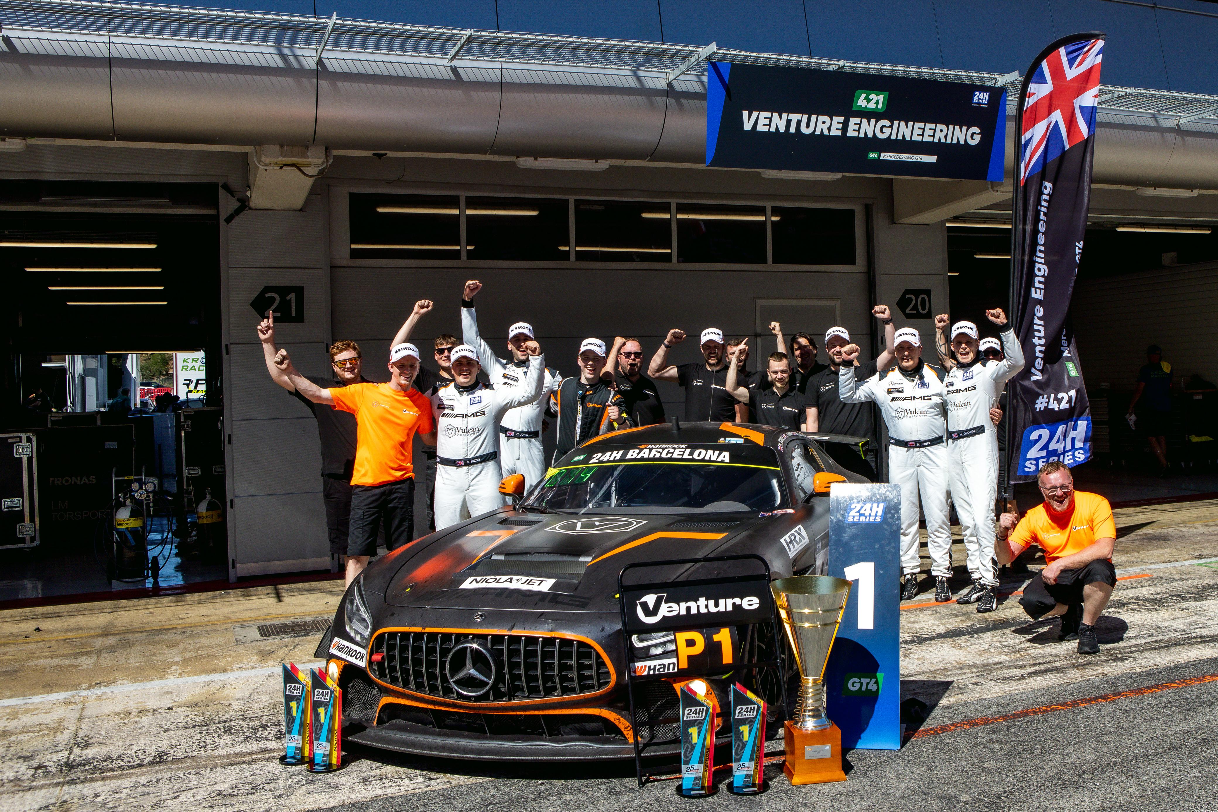 Owen Hizzey and the winning endurance team with the Mercedes-AMG and trophies