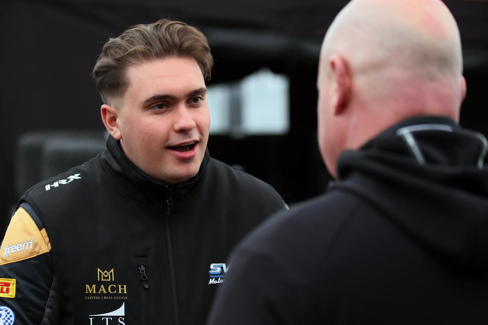 Owen Hizzey discussing performance in the paddock